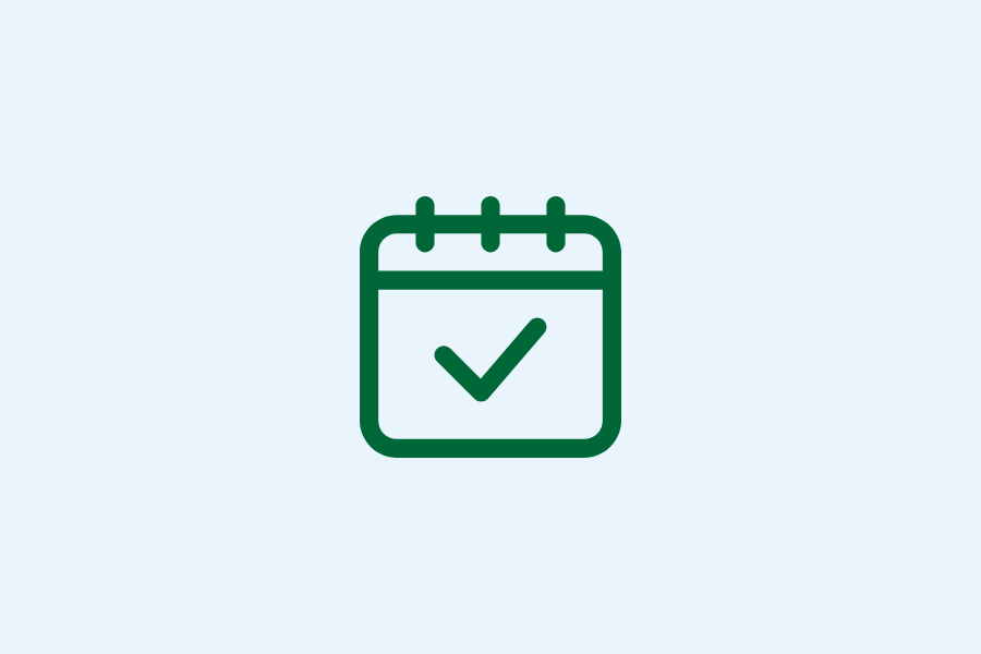 A green calendar icon with a checkmark in the center, displayed on a light gray background.